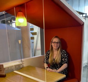 Front of house host at Engine Shed sitting in one of our Nooks